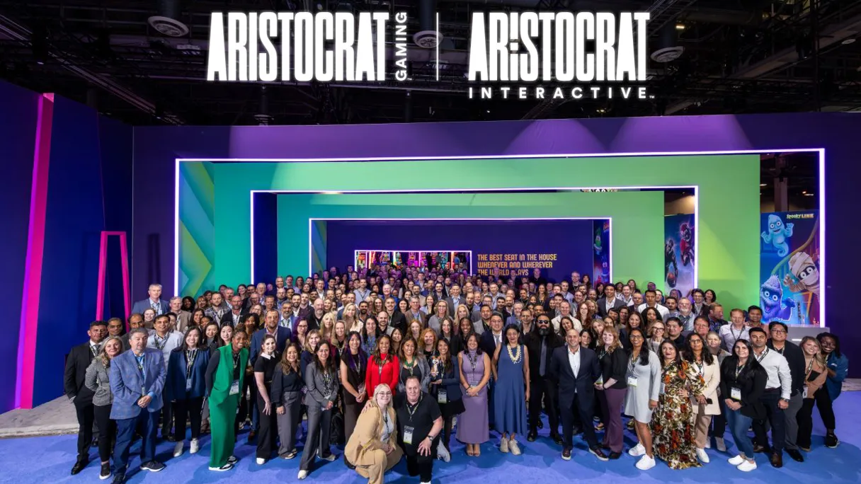 Group photo of Aristocrat Gaming and Aristocrat Interactive employees at an event